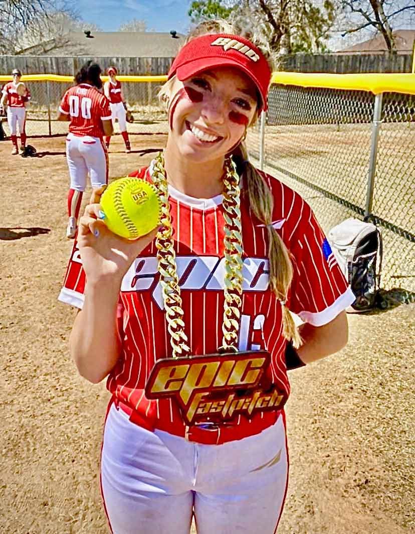 Softball player wearing an Epic chain and holding a ball.