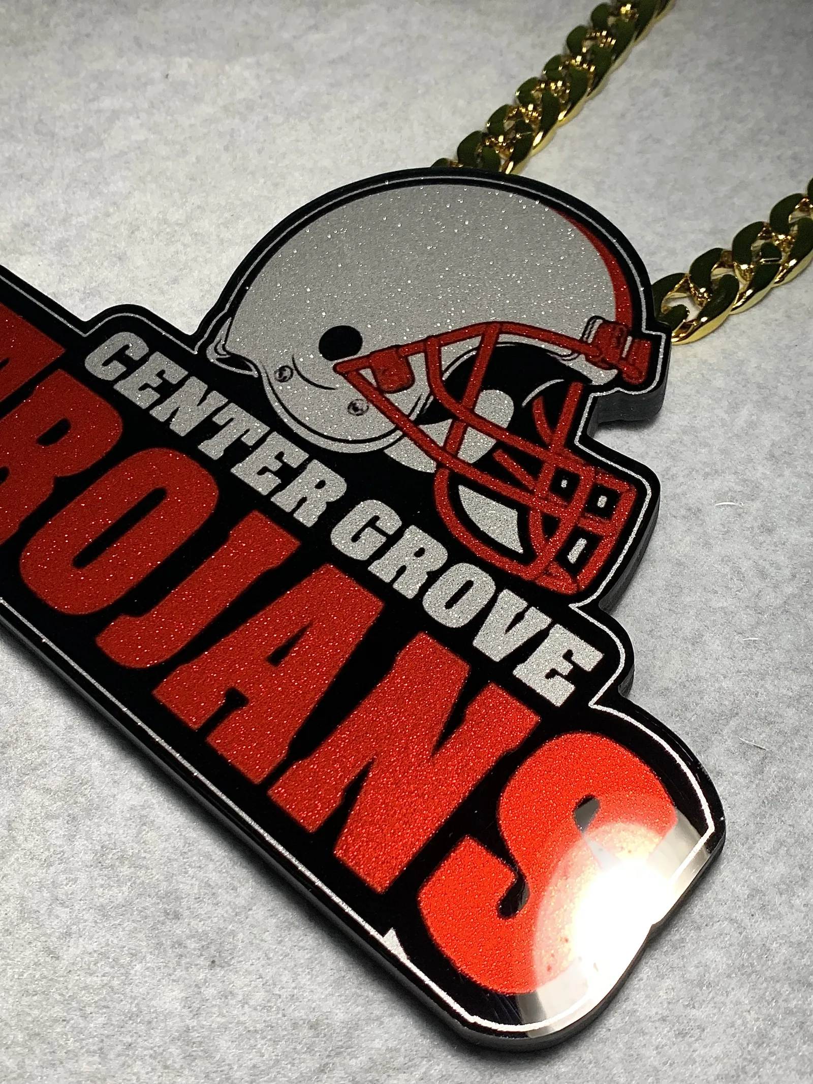 Center Grove Trojans text and logo pendant.