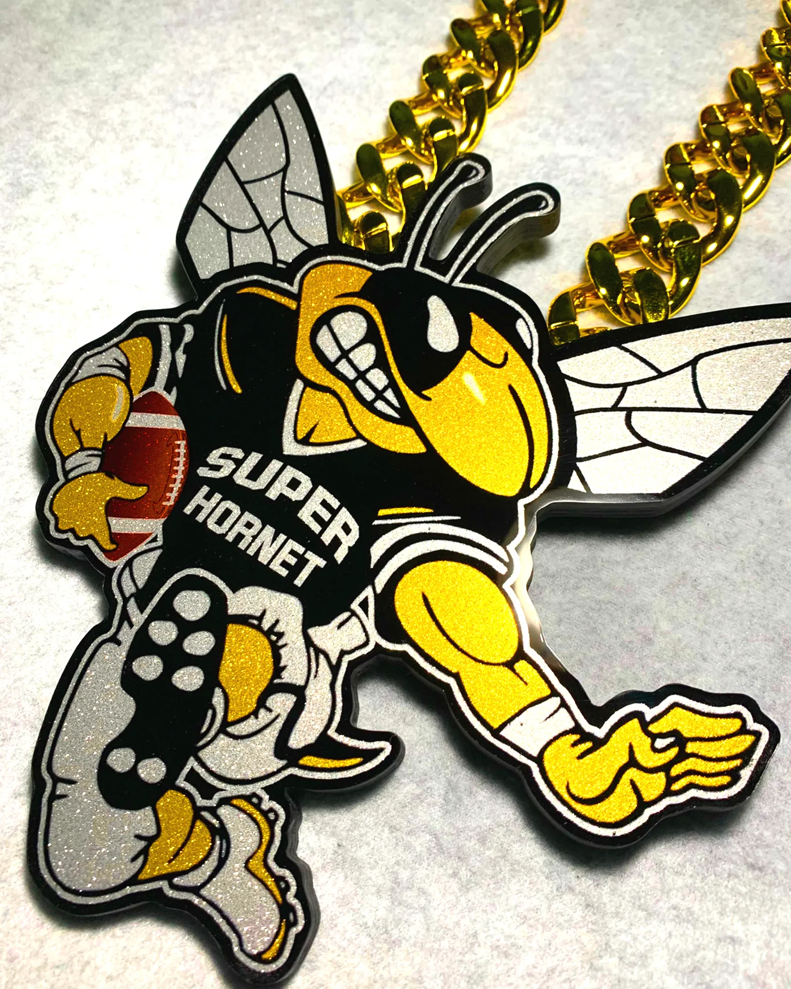 Super Hornet mascot pendant.