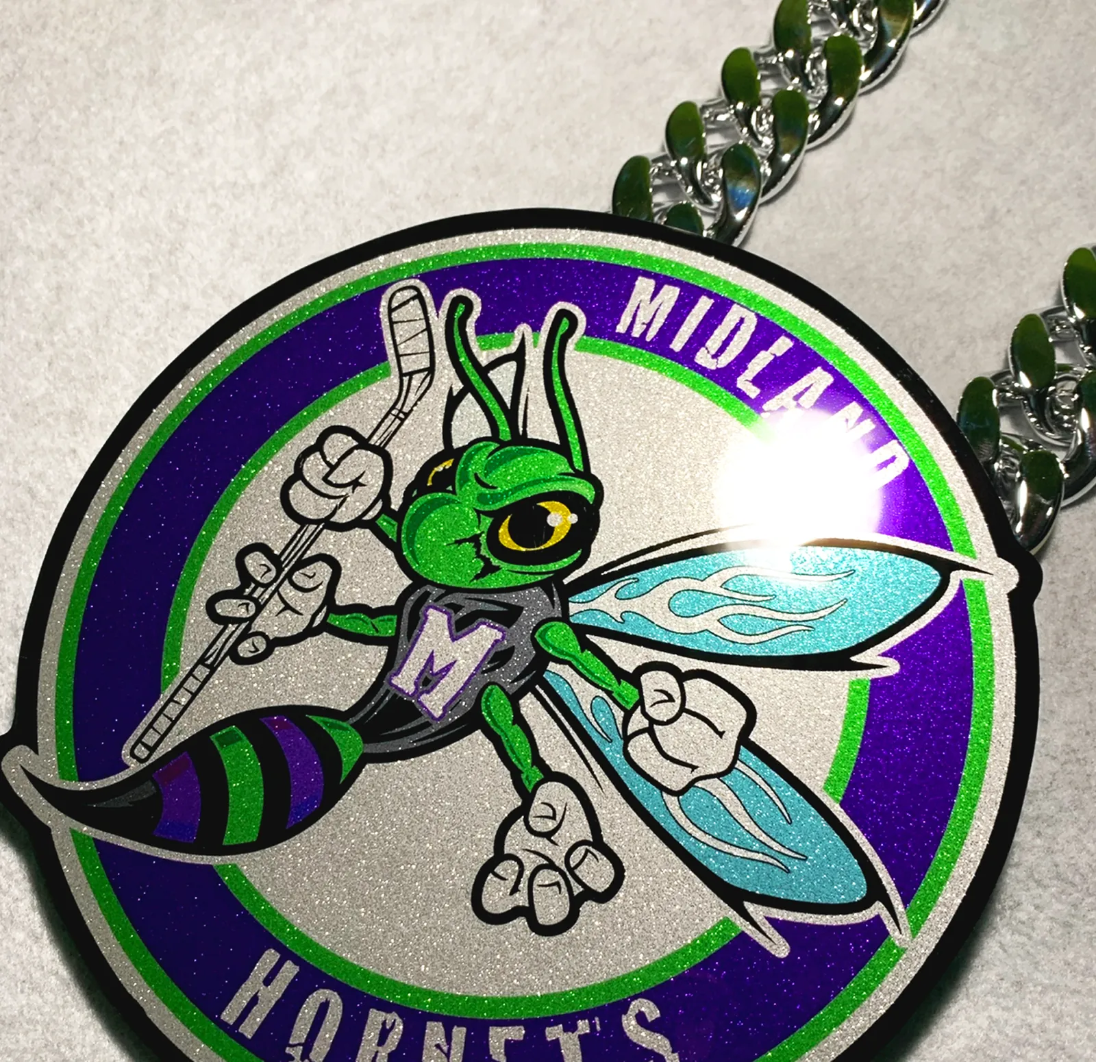 Midlakes Hornets circle pendant product shot.
